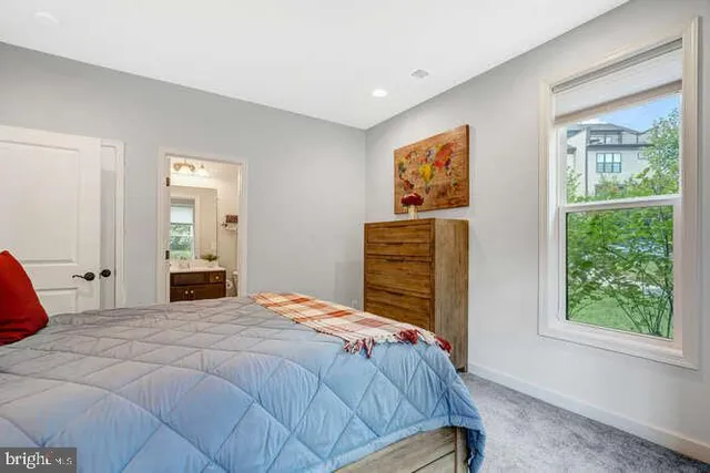 a bathroom with a sink vanity and toilet