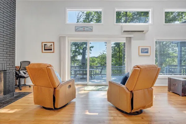 a living room with furniture and a ceiling fan