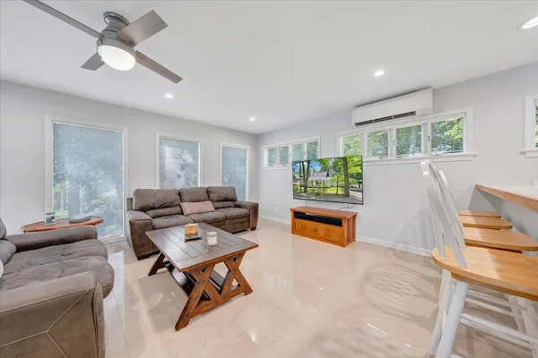 a bathroom with a sink and mirror with toilet