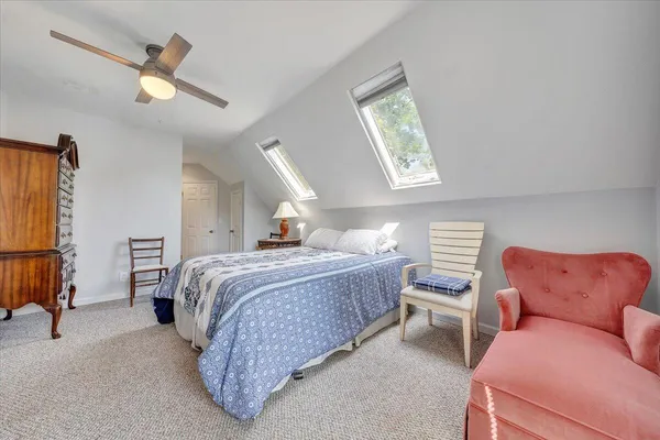 an aerial view of a house with a yard and garden