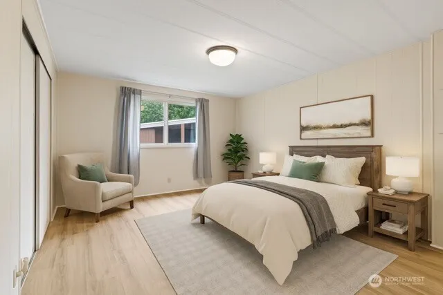 a bedroom with a large bed and a couch