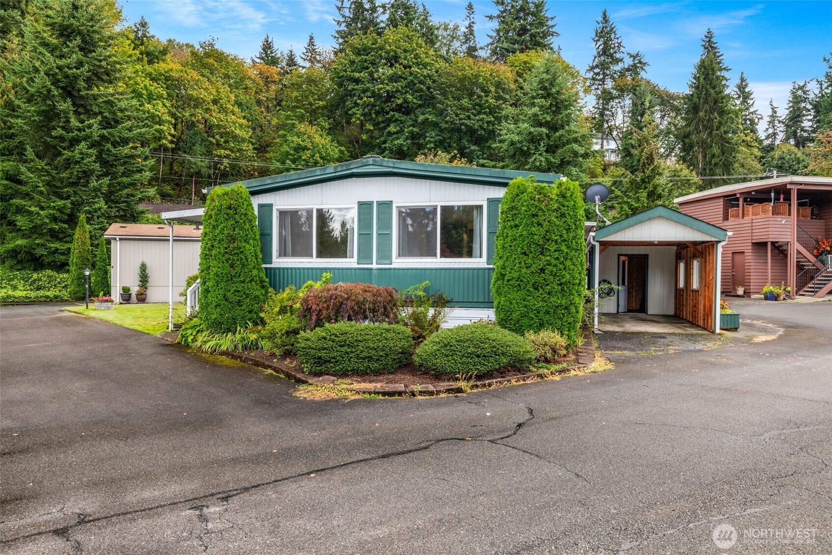 11330 East Riverside Drive, Unit 7 Bothell, WA 98011 - Photo 29 of 32 a front view of a house with a garden