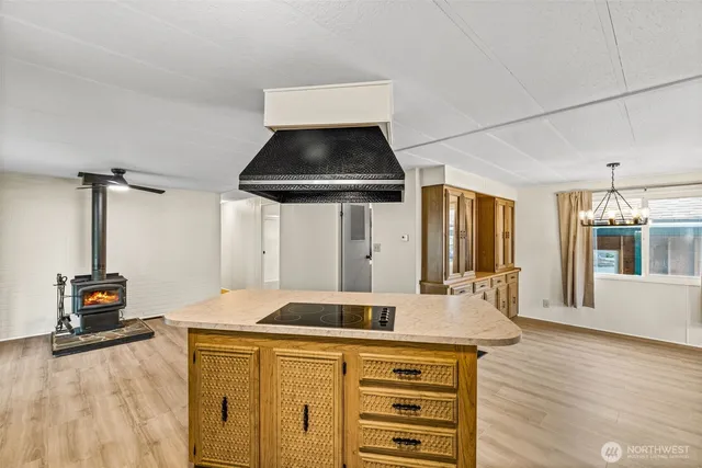 a kitchen with a sink and a stove top oven
