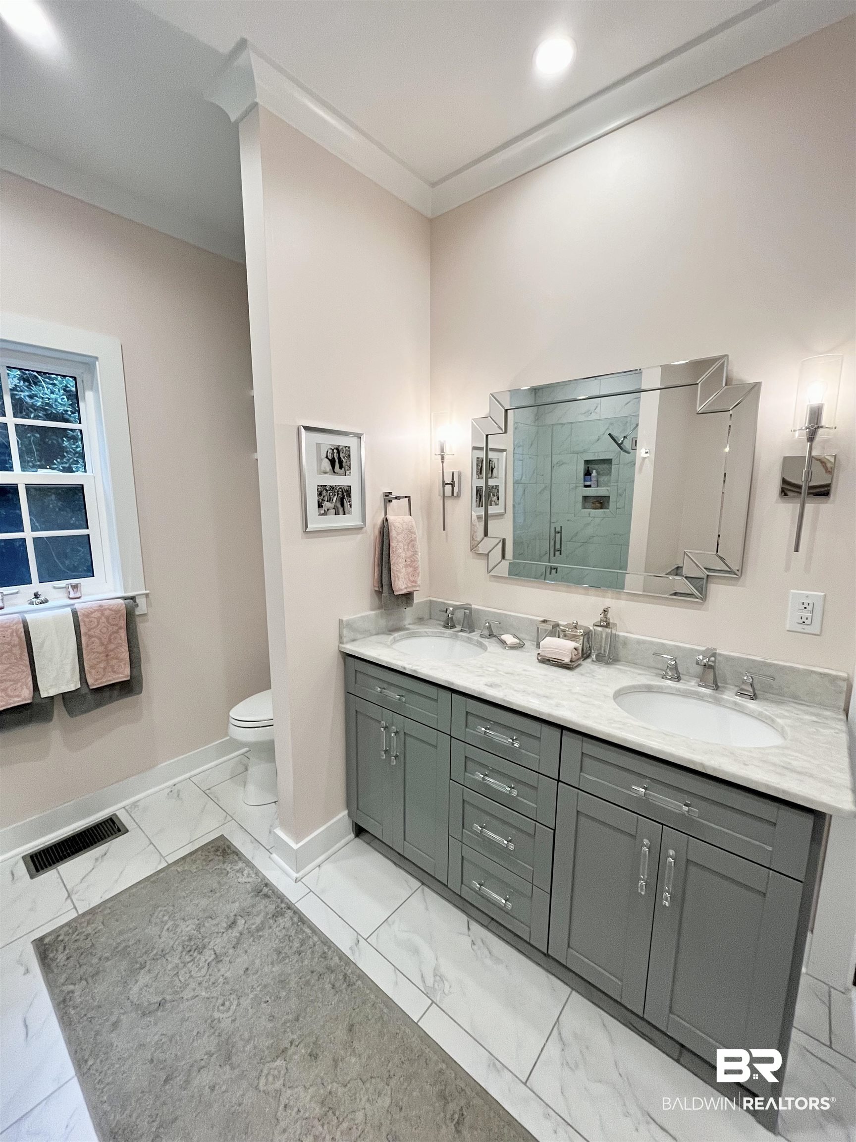 451 Ridgelawn Drive West Mobile, AL 36608 - Photo 11 of 41 Full bath with marble finish flooring, a stall shower, baseboards, double vanity, and toilet