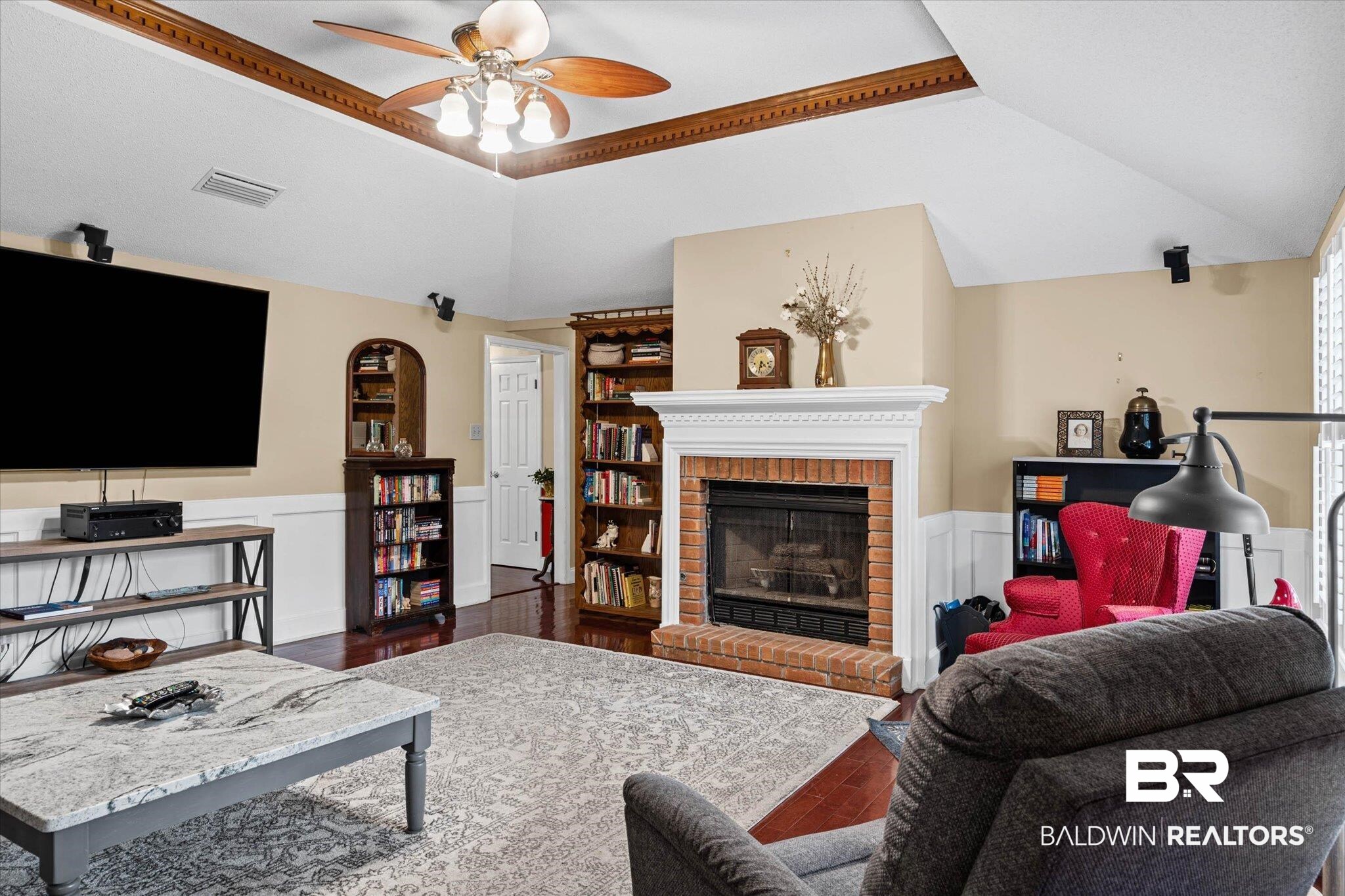7410 Smithfield Road East Mobile, AL 36695 - Photo 7 of 24 Vaulted ceiling with wood beam accents and ceiling fan