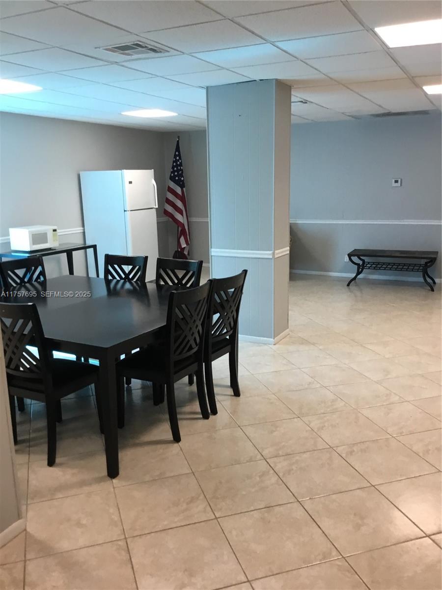 200 South Birch Road, Unit 404 Fort Lauderdale, FL 33316 - Photo 11 of 18 a view of a dining room with furniture