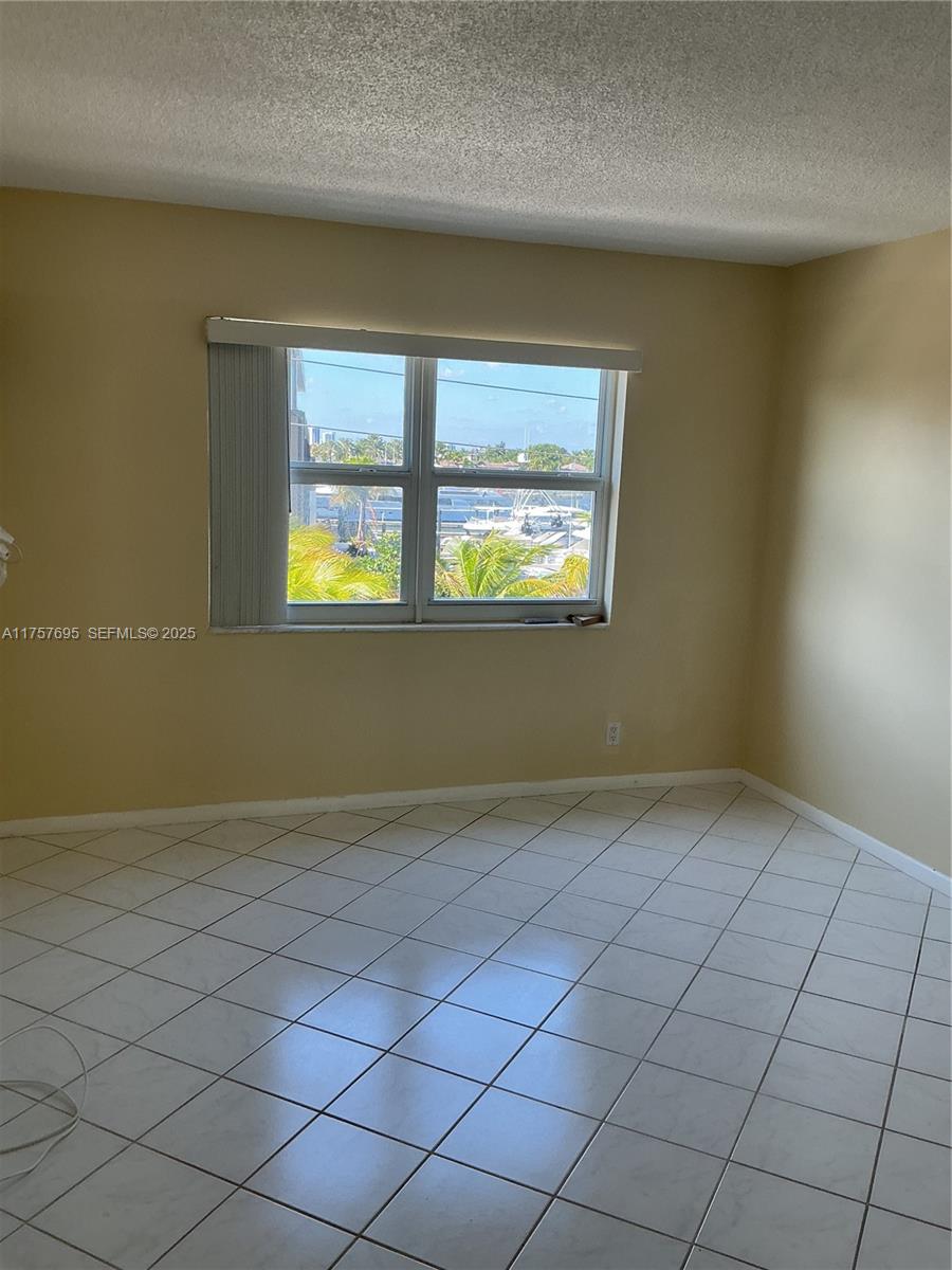 200 South Birch Road, Unit 404 Fort Lauderdale, FL 33316 - Photo 18 of 18 an empty room with windows