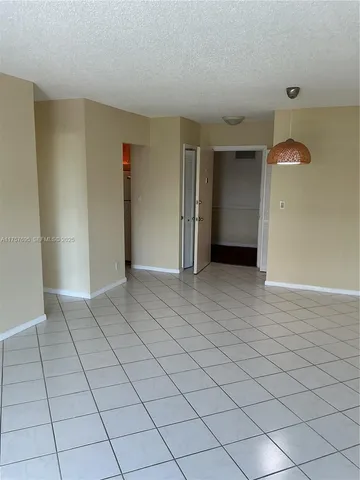 an empty room with a bathroom