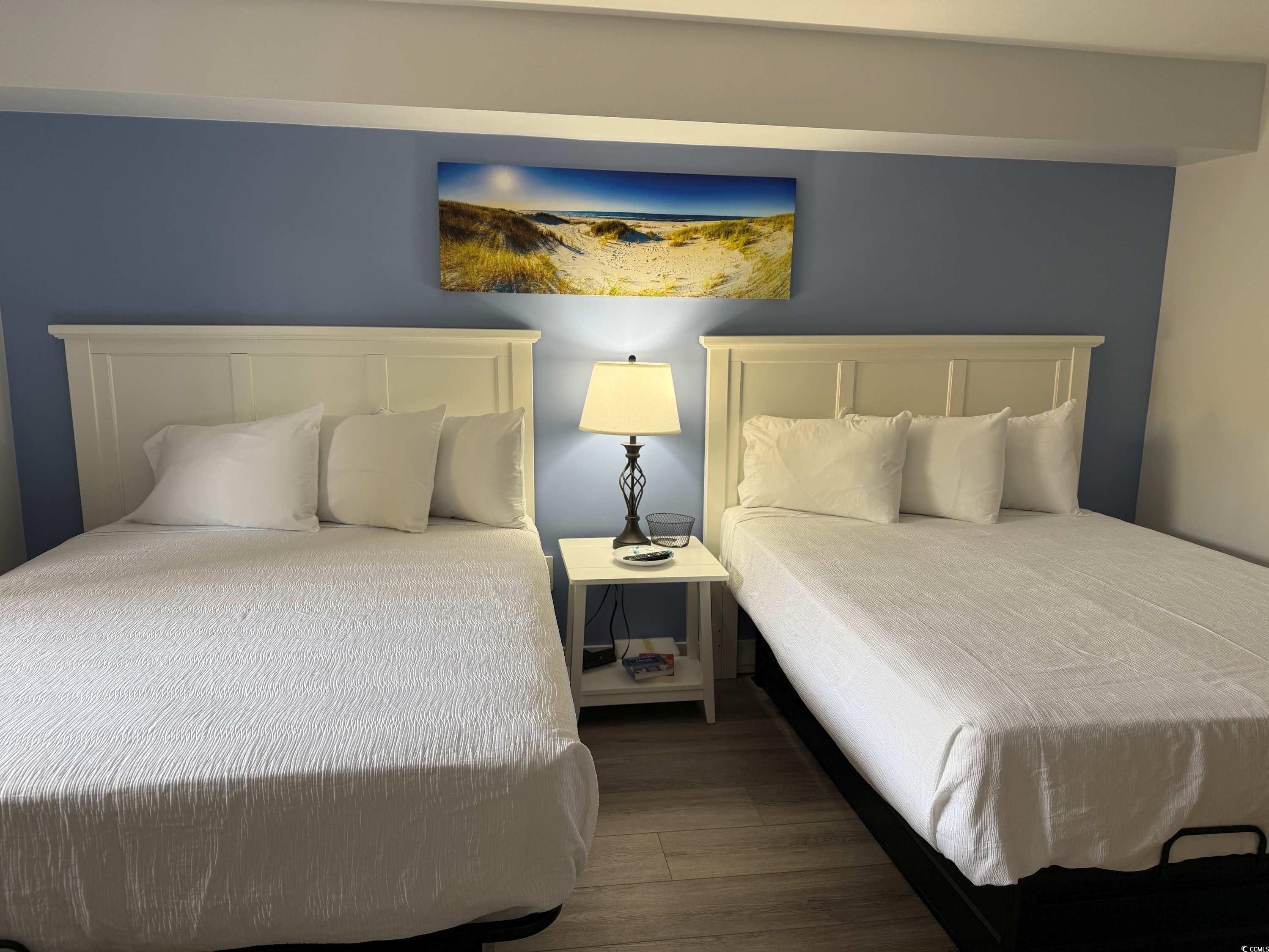 2000 North Ocean Boulevard, Unit CAMELOT 911 Myrtle Beach, SC 29577 - Photo 8 of 8 Bedroom with dark wood-type flooring