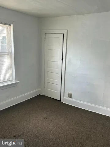 an empty room with a empty space and window
