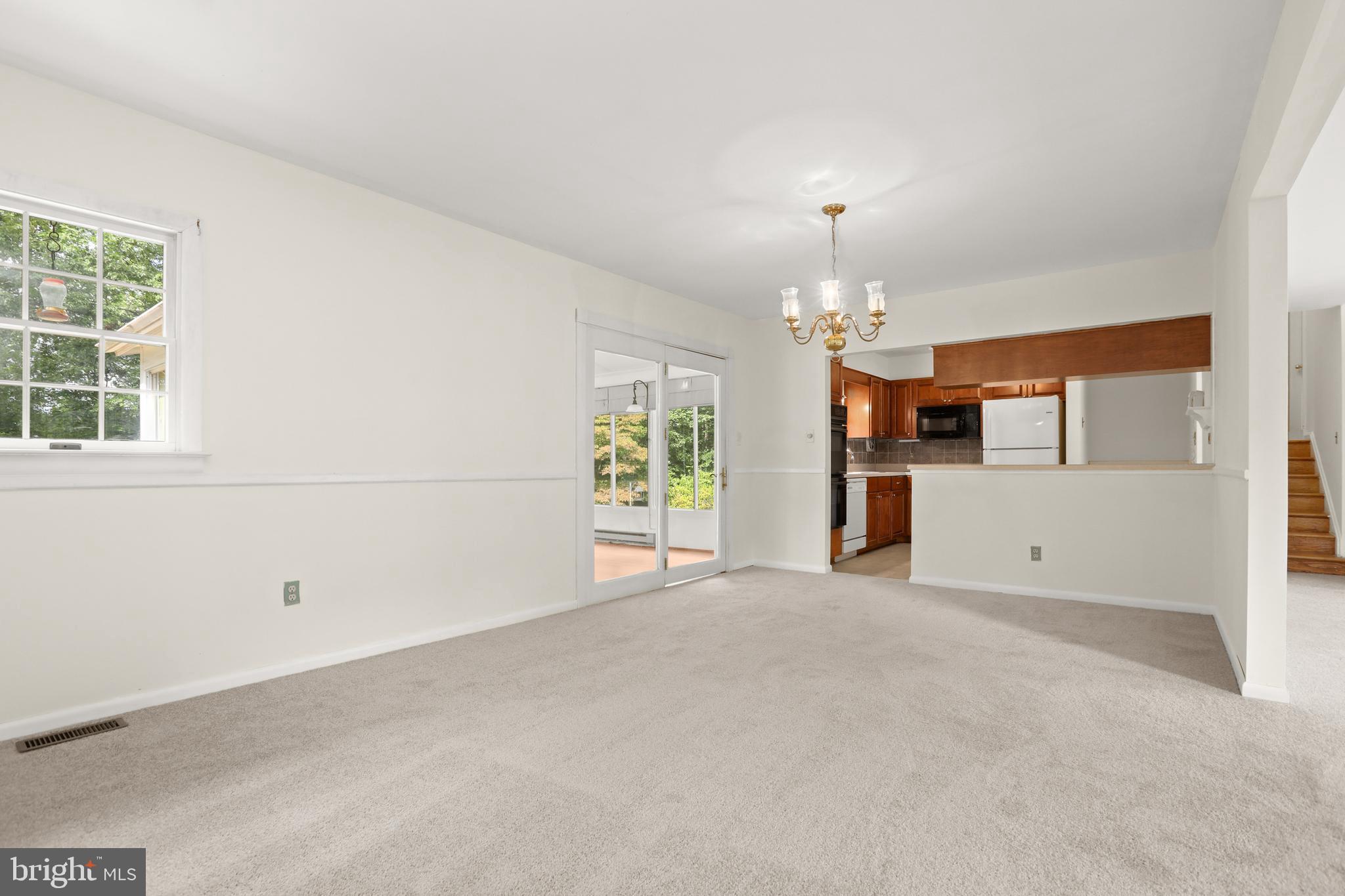 2402 Beverly Drive Joppa, MD 21085 - Photo 23 of 53 an empty room with chandelier and windows