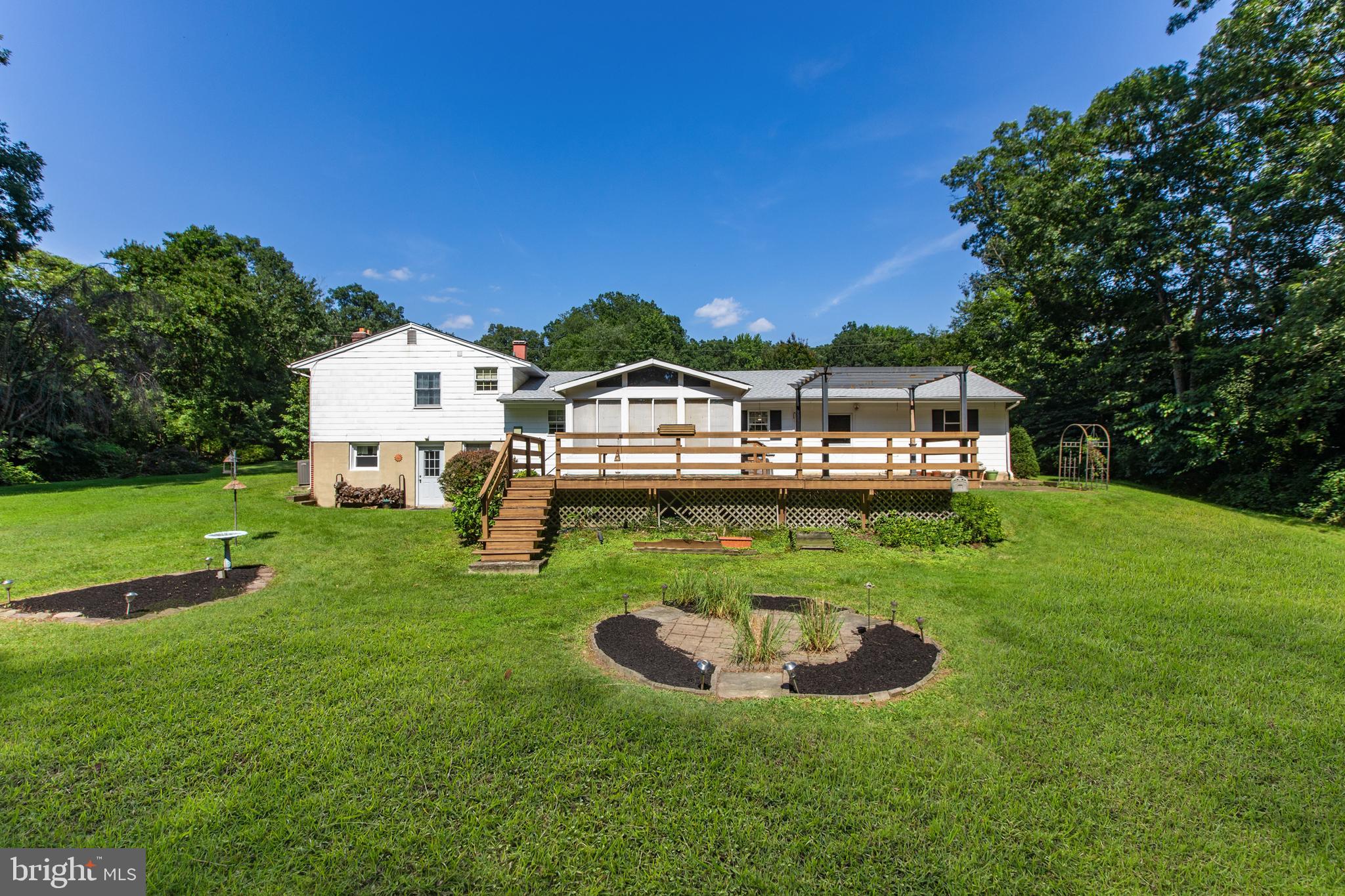 2402 Beverly Drive Joppa, MD 21085 - Photo 6 of 53 a view of a house with a yard porch and sitting area