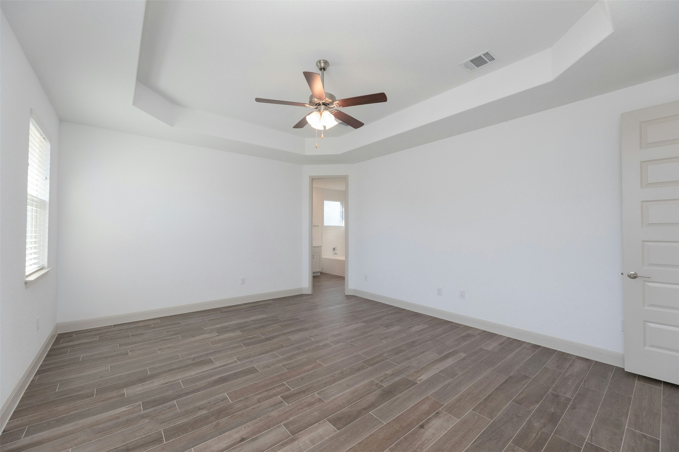 1736 Weavers Bend Georgetown, TX 78628 - Photo 17 of 40 Retreat to the expansive primary suite, a serene sanctuary set apart from the secondary bedrooms.