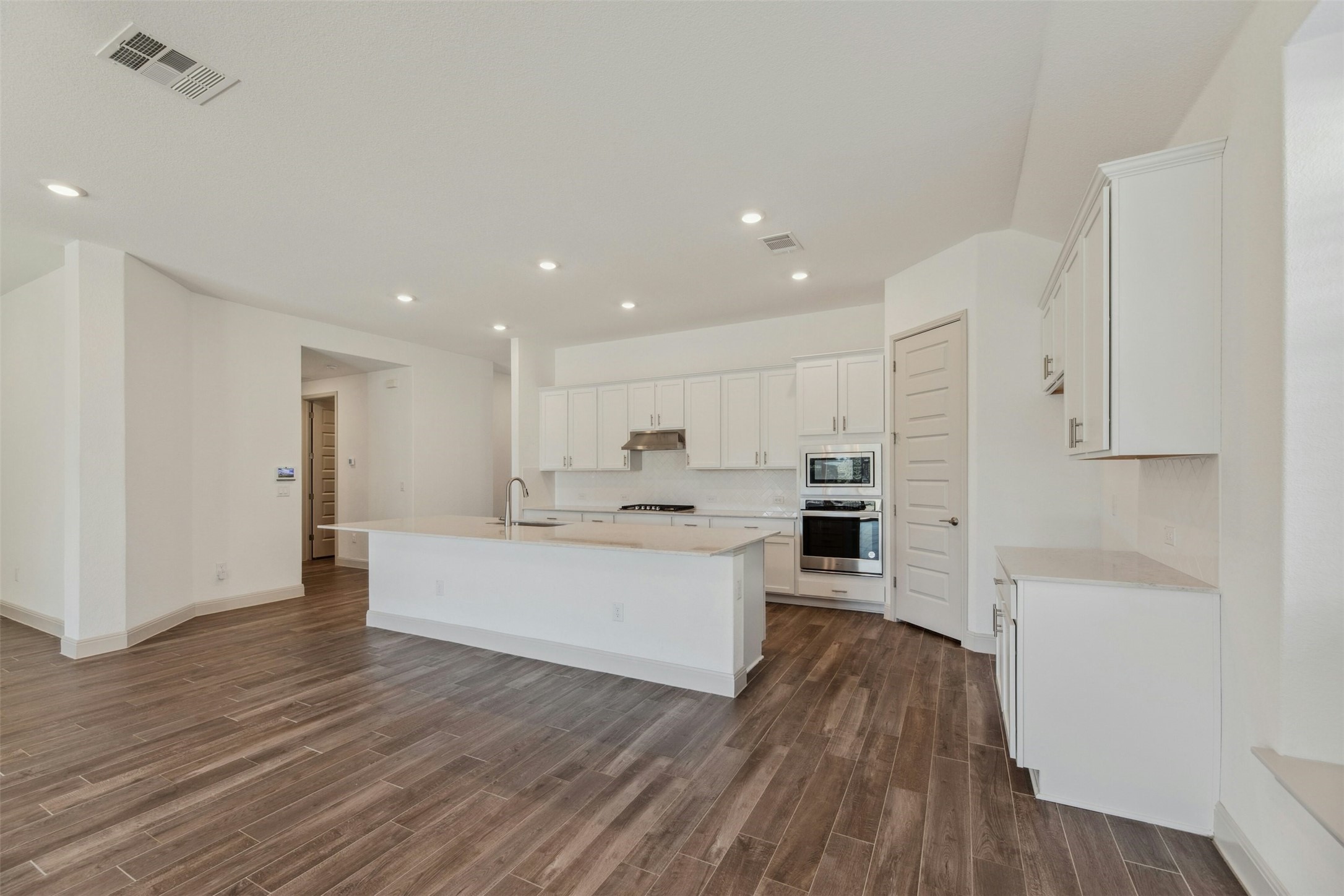 1736 Weavers Bend Georgetown, TX 78628 - Photo 9 of 40 A spacious center island with breakfast bar seating.