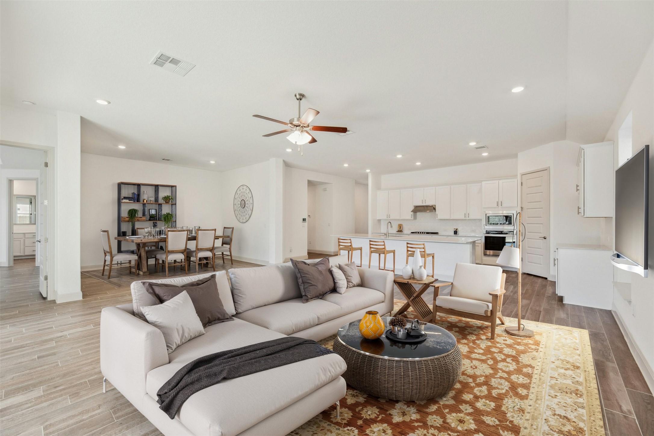 1736 Weavers Bend Georgetown, TX 78628 - Photo 10 of 40 The open-concept layout integrates the living room, island kitchen, and dining area and covered patio—perfect for effortless entertaining.