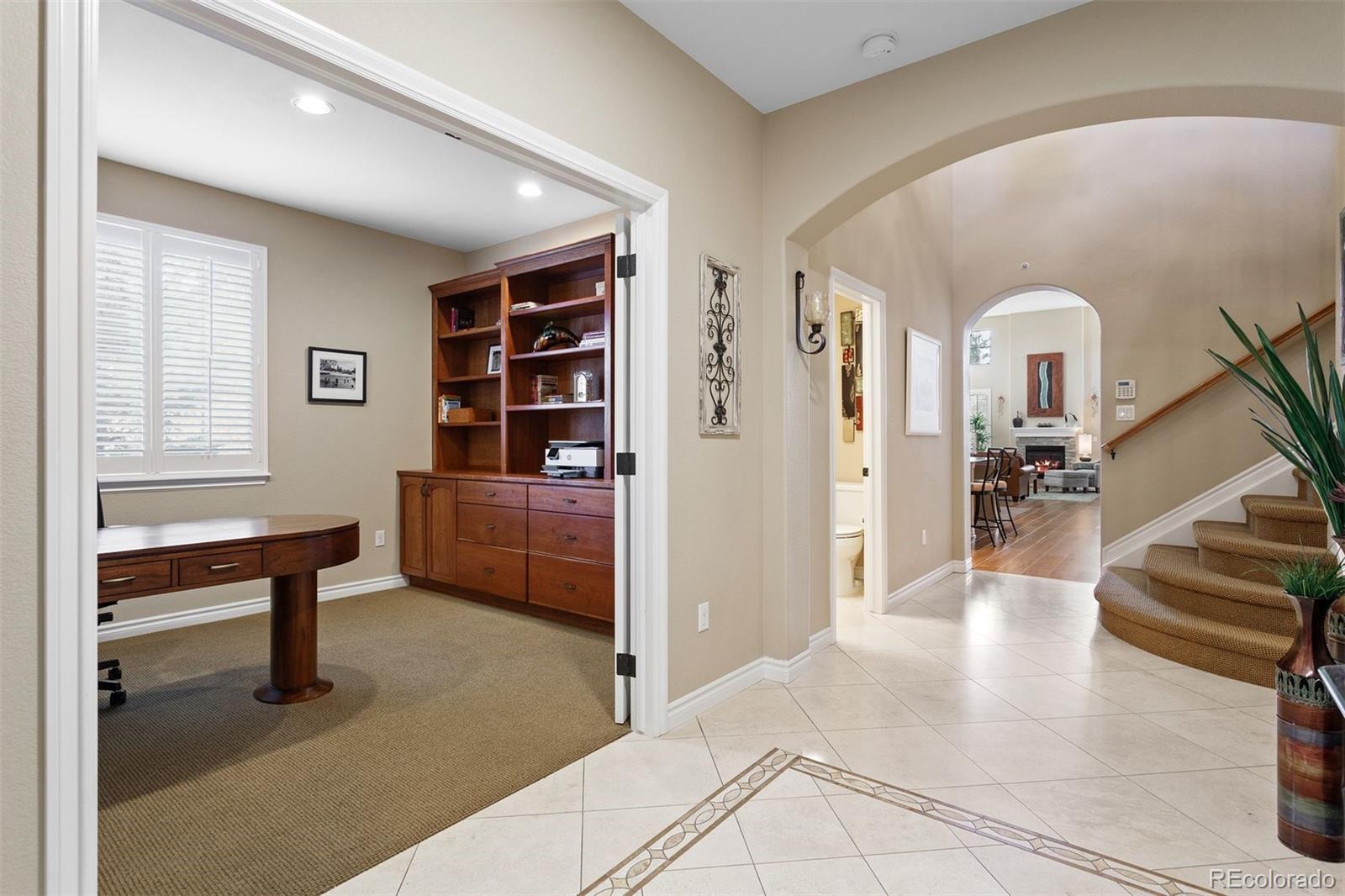 9236 Viaggio Way Highlands Ranch, CO 80126 - Photo 5 of 41 a living room with furniture and a window