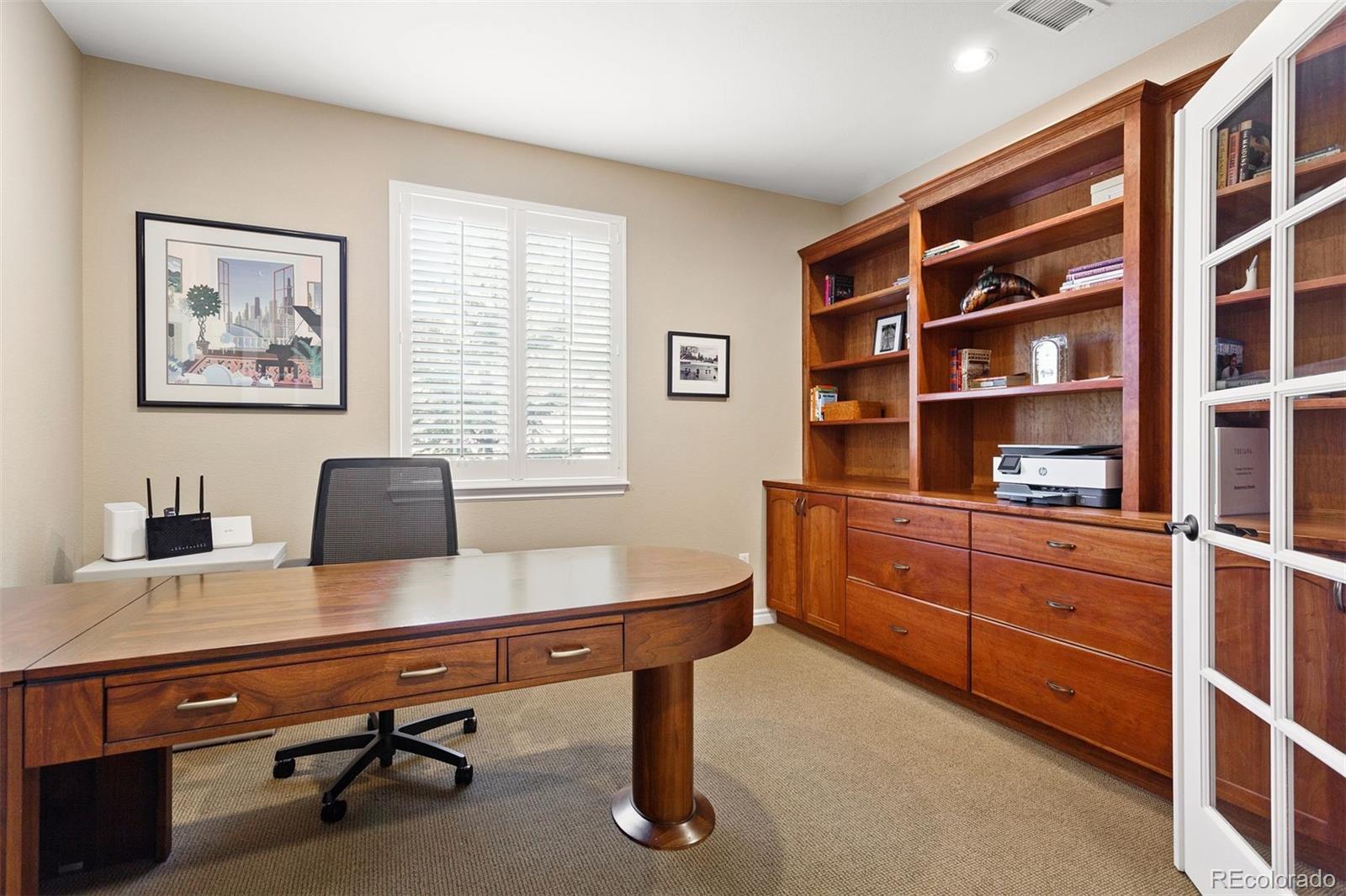 9236 Viaggio Way Highlands Ranch, CO 80126 - Photo 6 of 41 a view of a workspace with furniture and a window