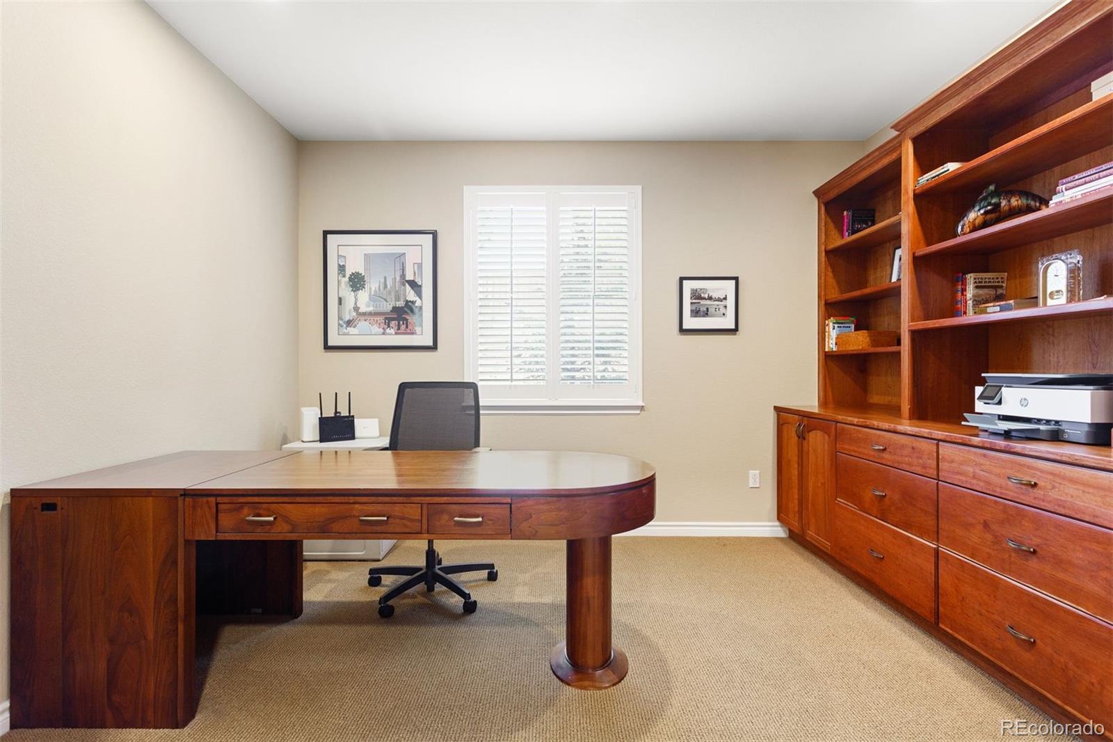 9236 Viaggio Way Highlands Ranch, CO 80126 - Photo 7 of 41 a view of a workspace with a bookshelf