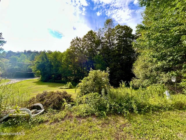 a view of a garden with a building
