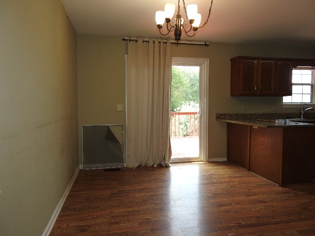 3557 Mahlon Moore Road Spring Hill, TN 37174 - Photo 11 of 29 wooden floor in an empty room with a window