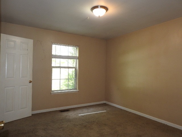 3557 Mahlon Moore Road Spring Hill, TN 37174 - Photo 23 of 29 an empty room with a window