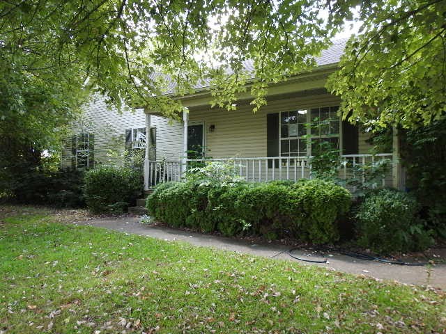 3557 Mahlon Moore Road Spring Hill, TN 37174 - Photo 3 of 29 a front view of a house with garden