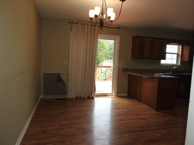 3557 Mahlon Moore Road Spring Hill, TN 37174 - Photo 9 of 29 wooden floor in an empty room with a window