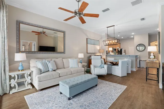 a bathroom with a granite countertop double vanity sink and a mirror