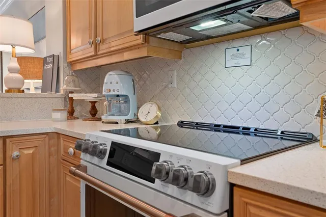 a bathroom with a double vanity sink toilet mirror and shower