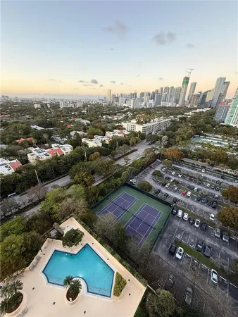 a view of a large building with a swimming pool
