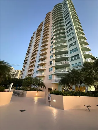 a view of a swimming pool with sitting area