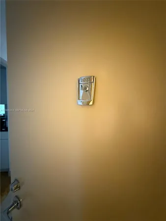 a living room with furniture a patio and a large window