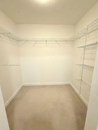 an empty room with a empty space and windows