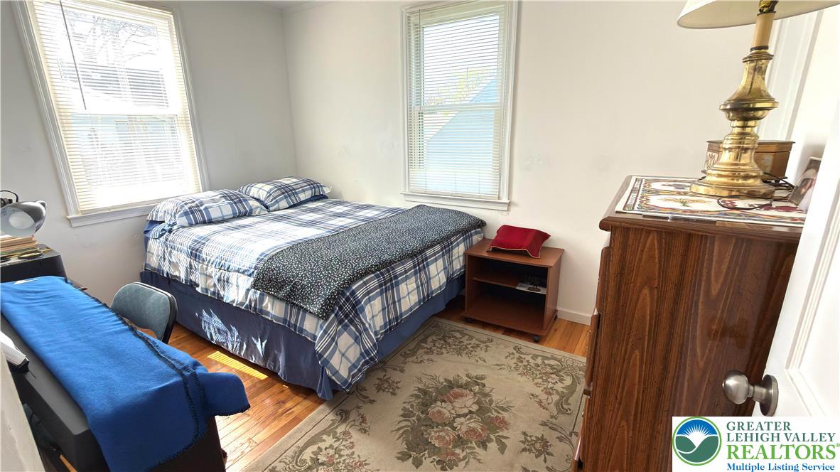 462 Maple Road Hellertown, PA 18055 - Photo 14 of 25 a bedroom with a bed and wooden floor