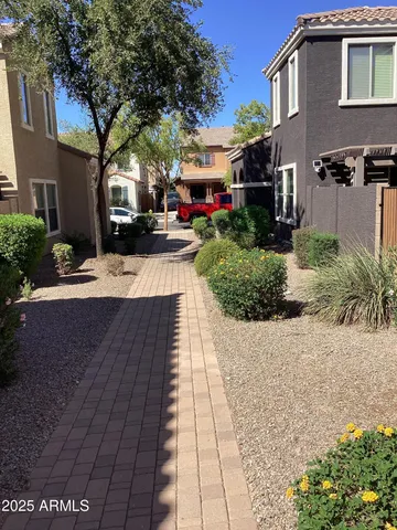 a view of a house with a snow on the road