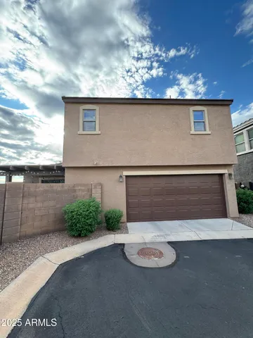 a large kitchen with kitchen island a large counter space stainless steel appliances and cabinets