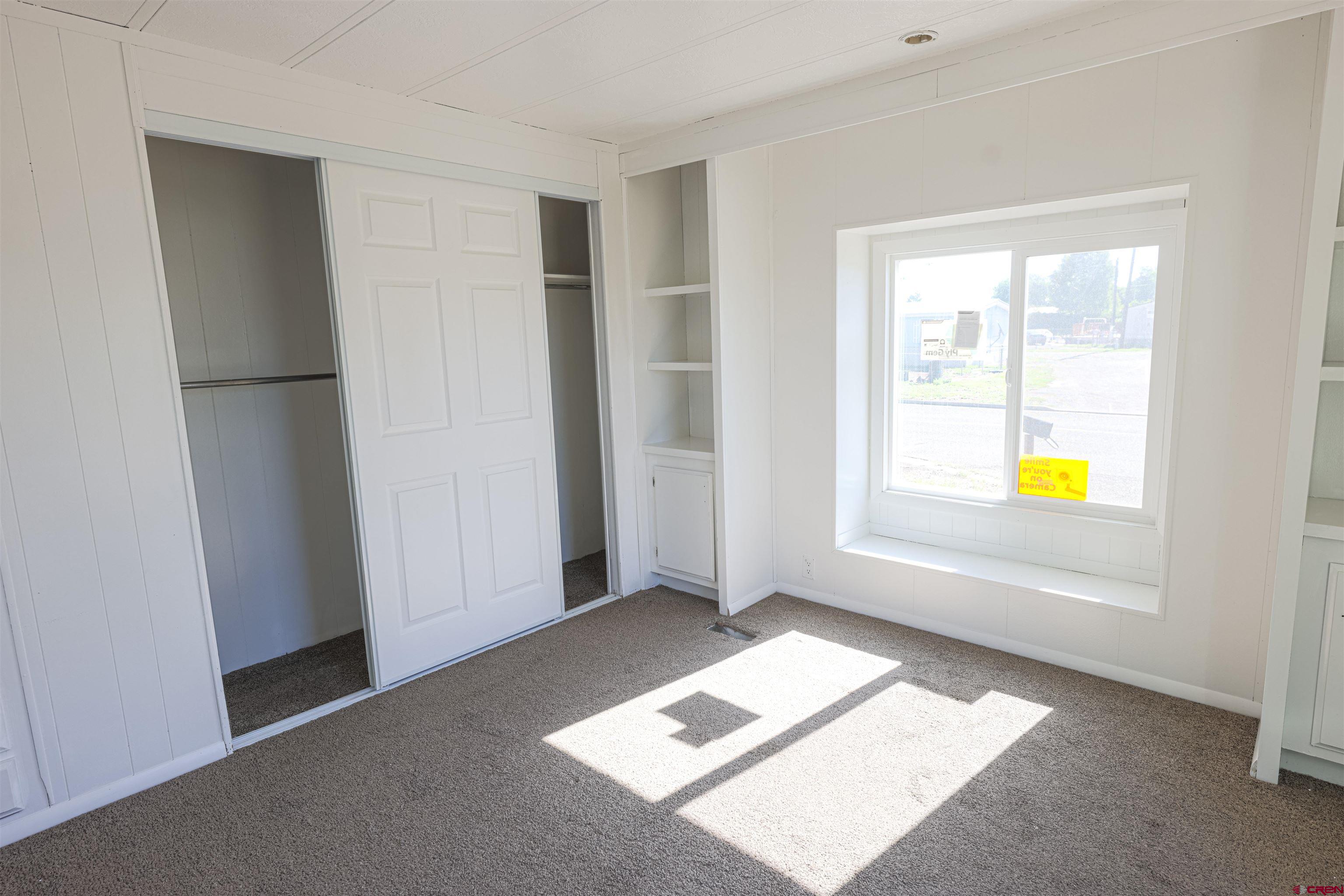 11 Rickey Place Monte Vista, CO 81144 - Photo 11 of 20 a view of an empty room and window