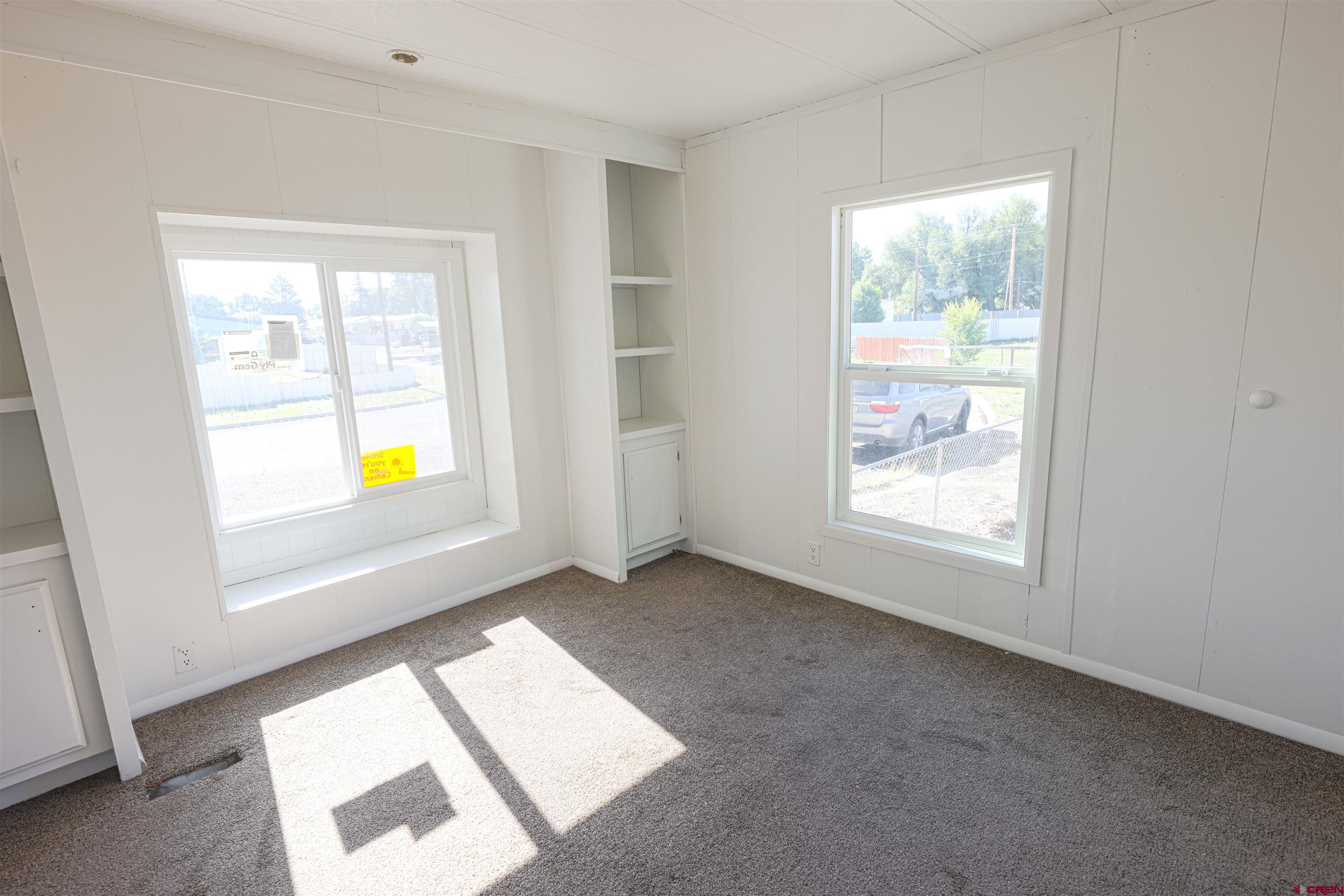 11 Rickey Place Monte Vista, CO 81144 - Photo 12 of 20 an empty room with windows