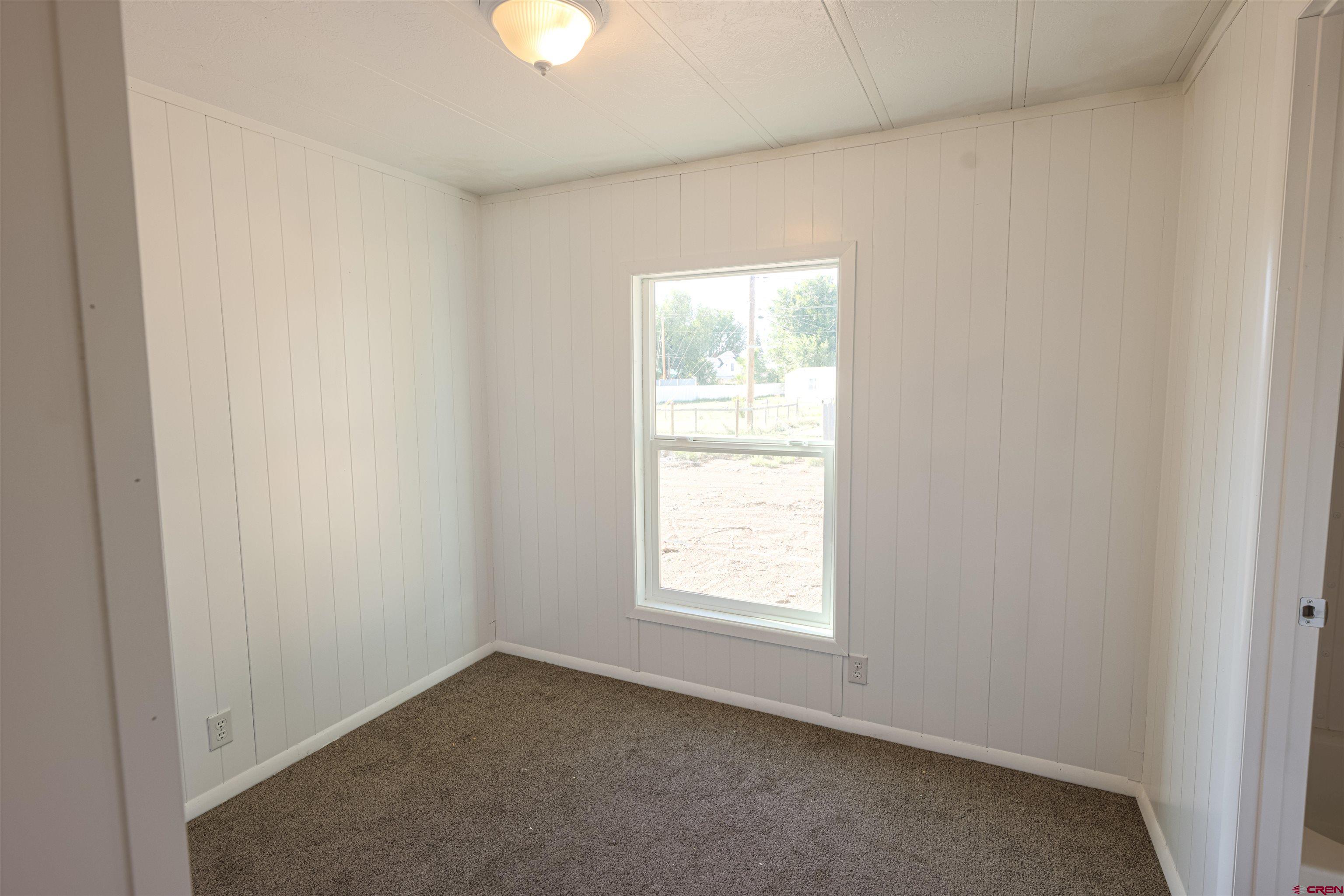 11 Rickey Place Monte Vista, CO 81144 - Photo 14 of 20 an empty room with a window