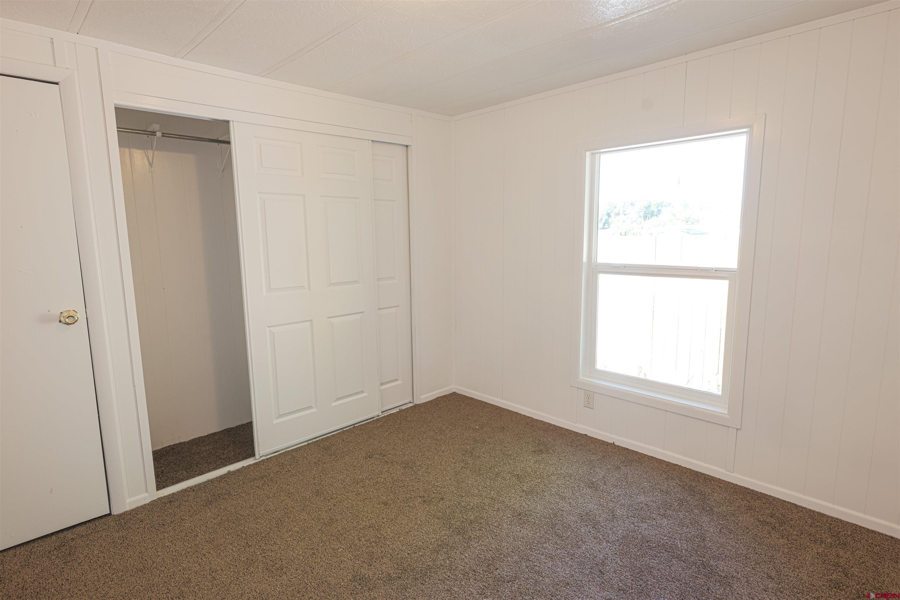 11 Rickey Place Monte Vista, CO 81144 - Photo 17 of 20 an empty room with a window