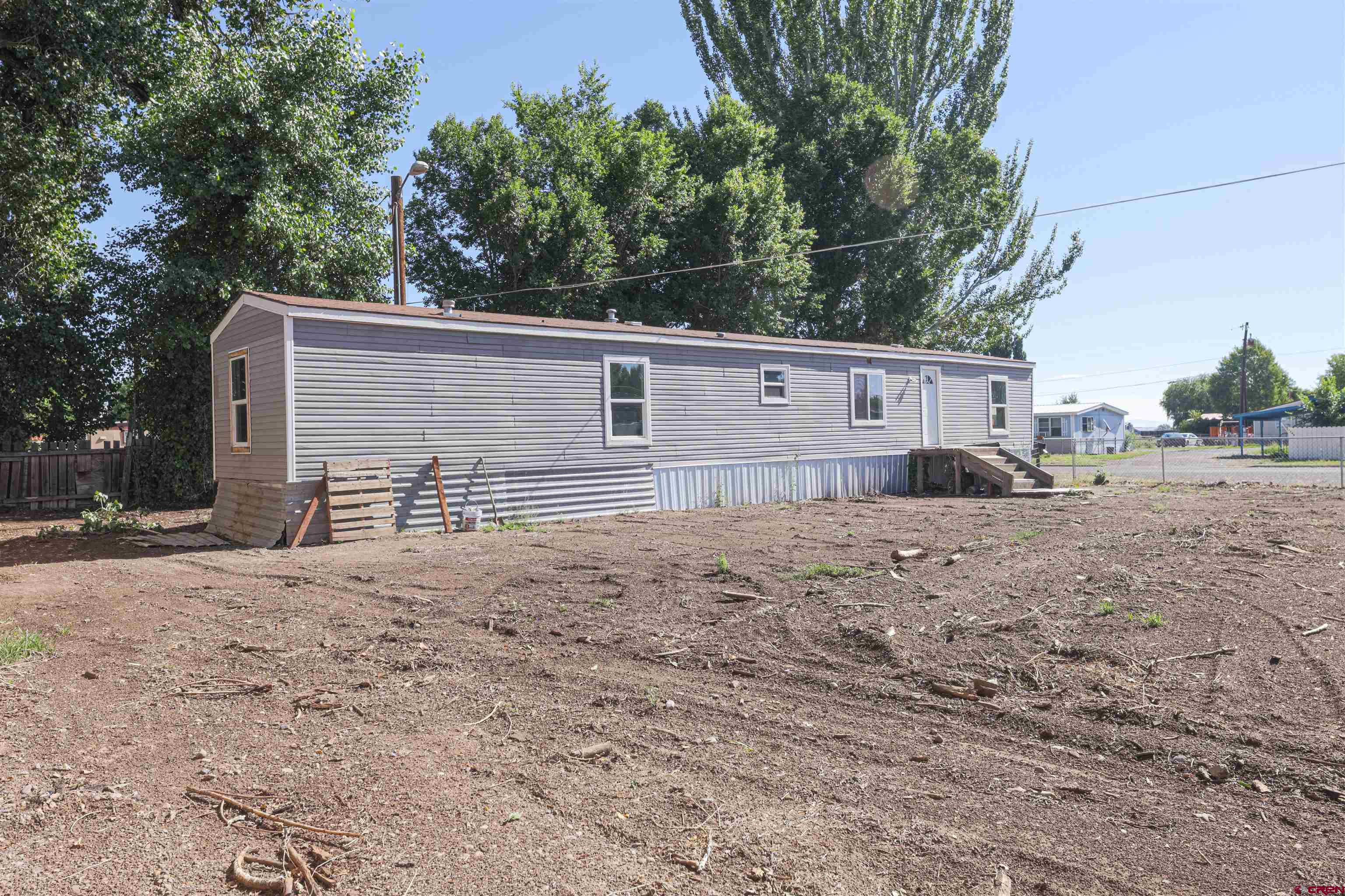 11 Rickey Place Monte Vista, CO 81144 - Photo 19 of 20 a view of a house with a backyard