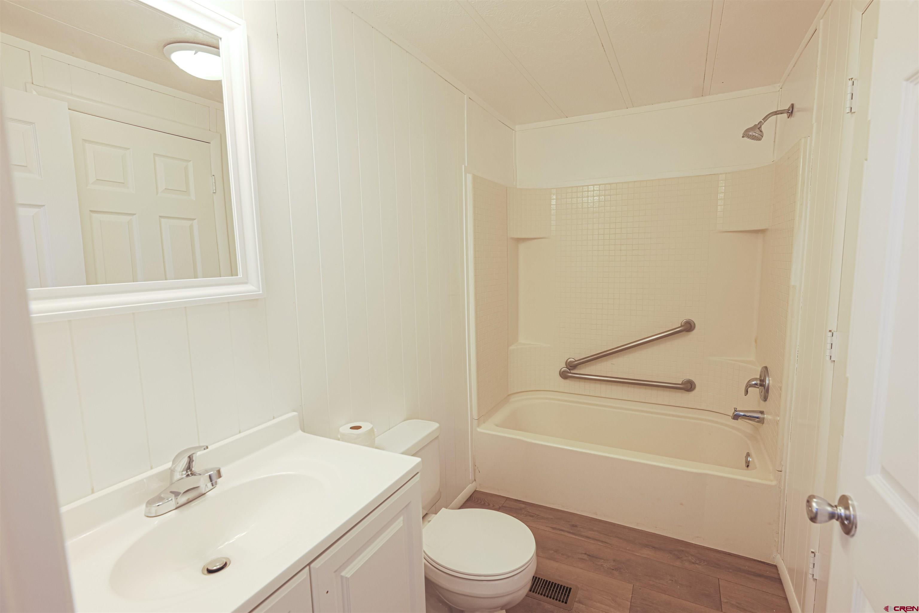 11 Rickey Place Monte Vista, CO 81144 - Photo 10 of 20 a bathroom with a sink toilet and shower