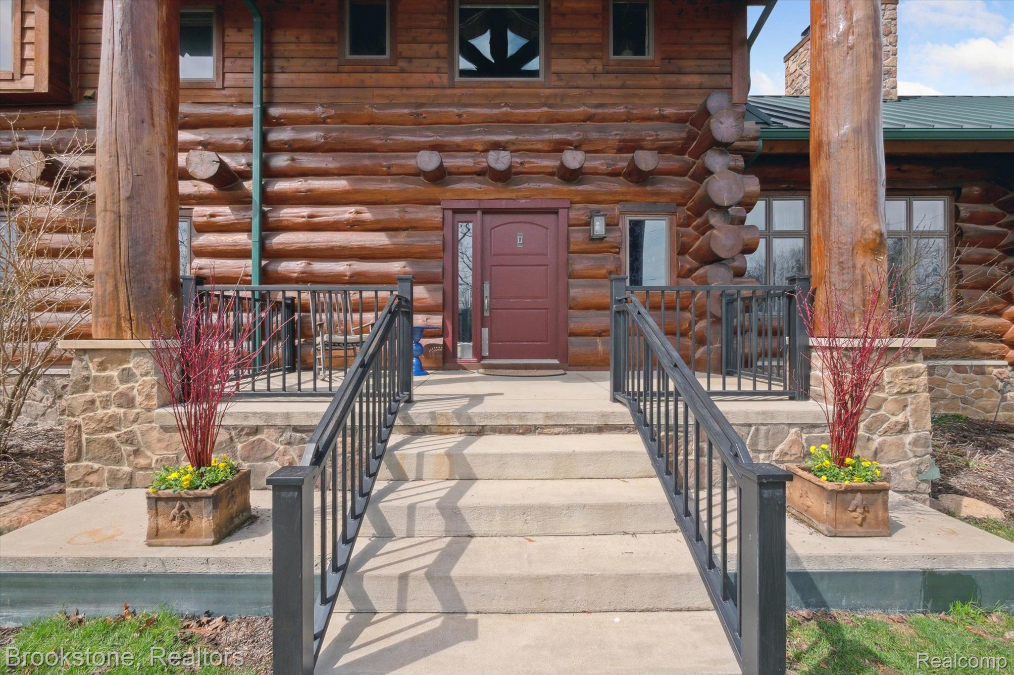 8695 Ellis Road Clarkston, MI 48348 - Photo 6 of 69 Covered entryway with dramatic red pine timbers