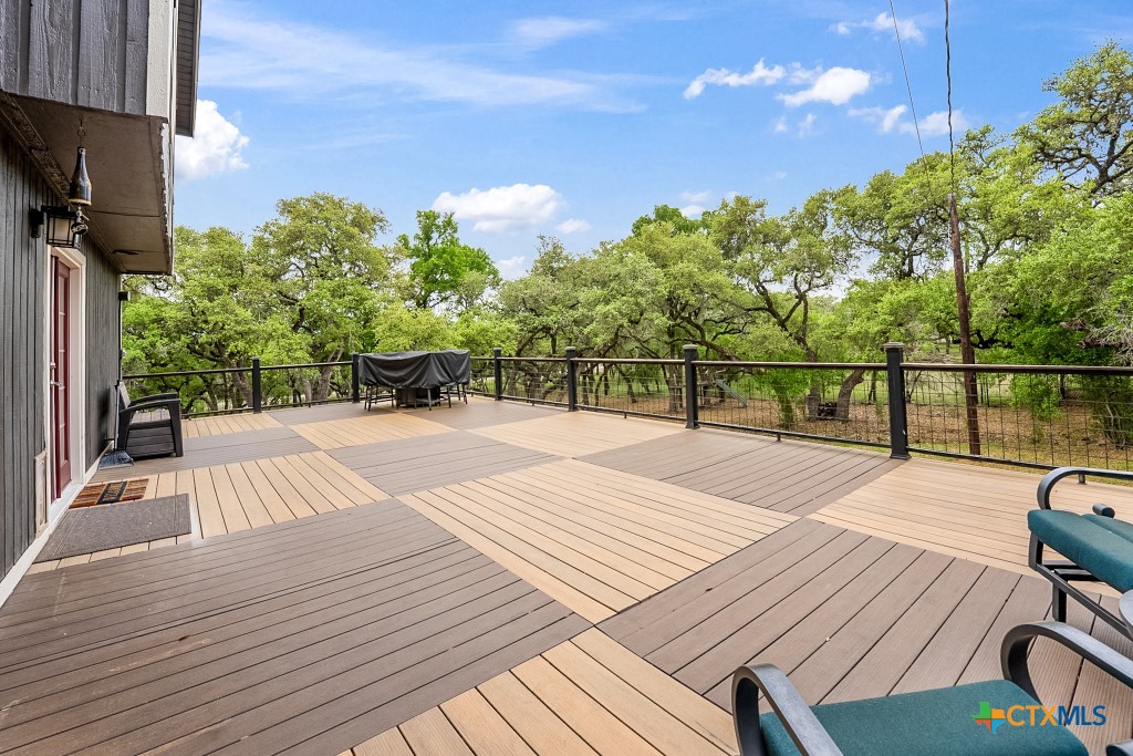 805 Sunrise Trail Spring Branch, TX 78070 - Photo 17 of 25 a view of a balcony with wooden floor