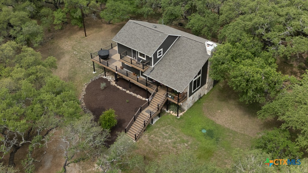 805 Sunrise Trail Spring Branch, TX 78070 - Photo 23 of 25 an aerial view of a house with yard and trees