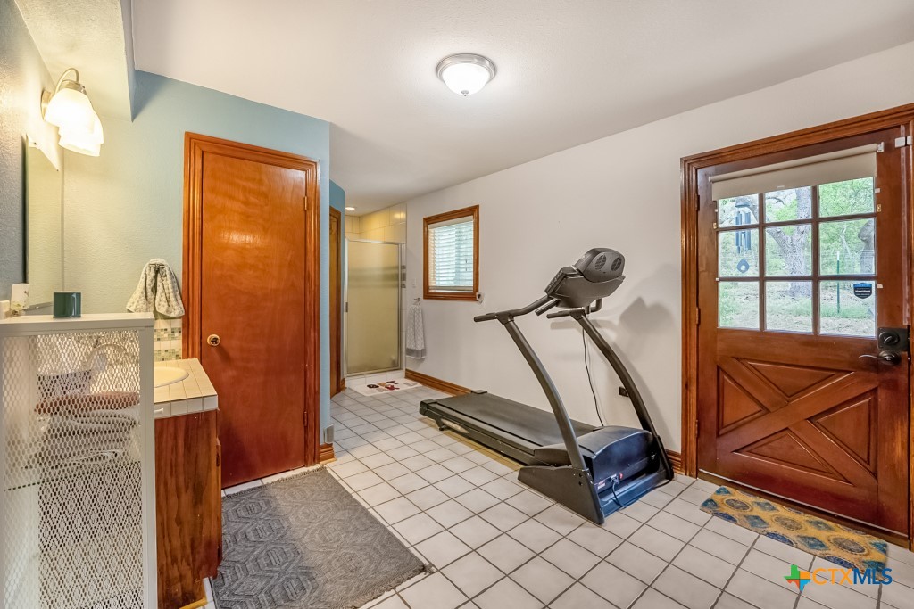 805 Sunrise Trail Spring Branch, TX 78070 - Photo 10 of 25 a view of a room with gym equipment