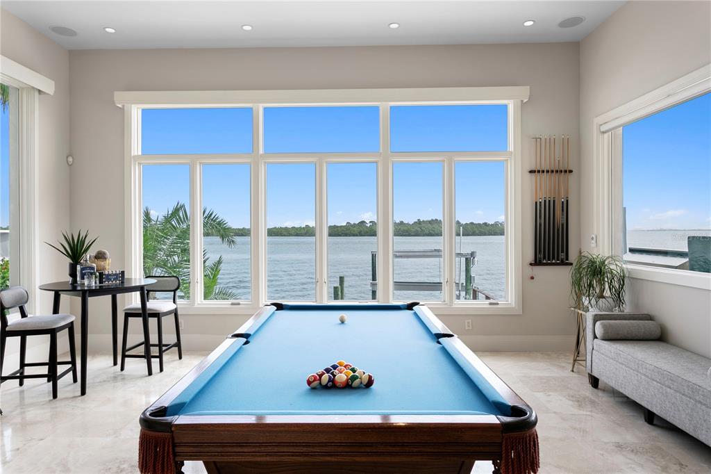 2279 Mermaid Point Northeast St. Petersburg, FL 33703 - Photo 35 of 100 a living room with furniture pool table and a large window