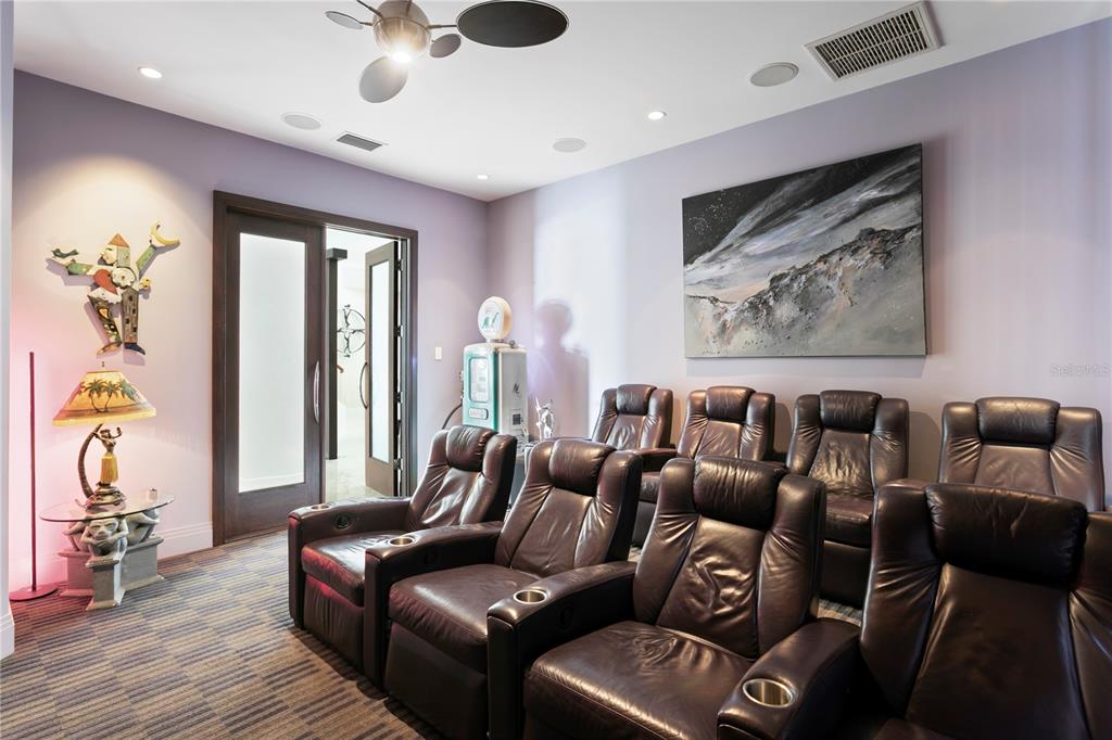 2279 Mermaid Point Northeast St. Petersburg, FL 33703 - Photo 41 of 100 a media room with lots of chairs and wooden floor