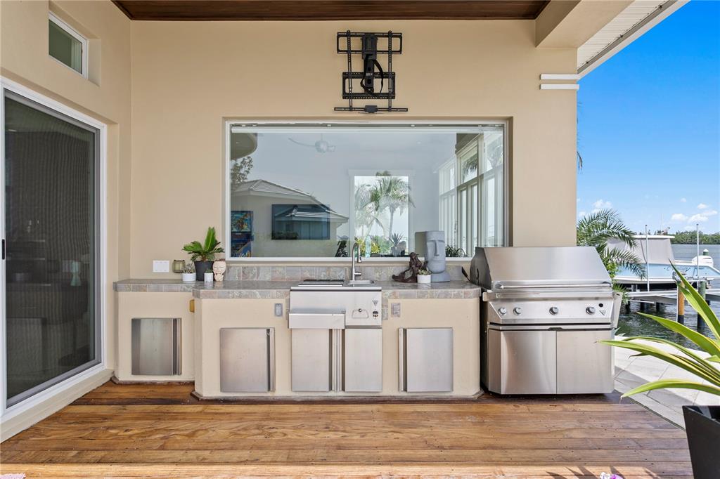 2279 Mermaid Point Northeast St. Petersburg, FL 33703 - Photo 58 of 100 a kitchen with stainless steel appliances granite countertop a stove a sink and a refrigerator