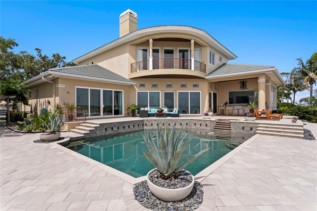 2279 Mermaid Point Northeast St. Petersburg, FL 33703 - Photo 6 of 100 a front view of a house with swimming pool